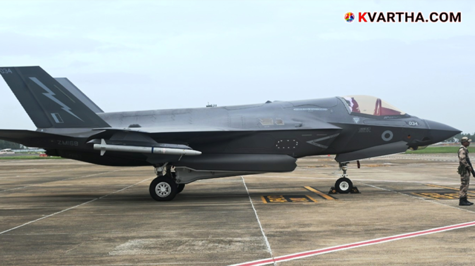 A US F-35 Lightning II fighter jet on a runway at a military base.