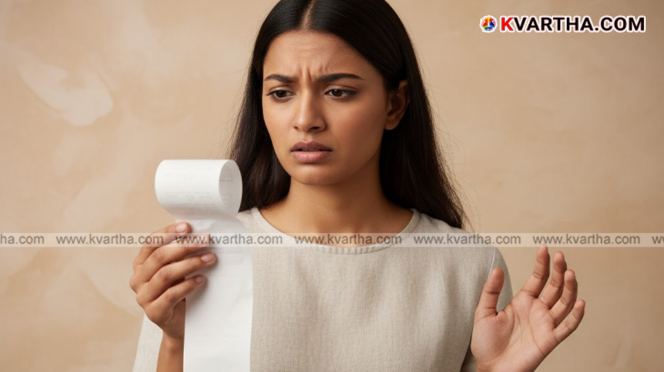 Hand holding a thermal shopping receipt.