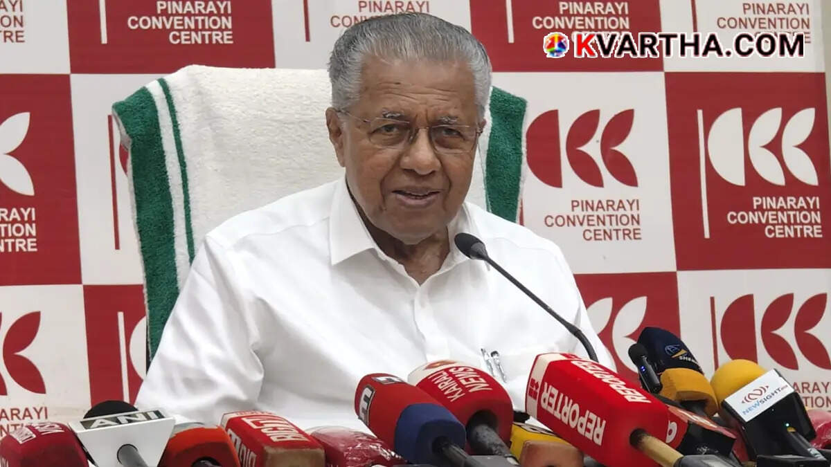 Opposition Leader Pinarayi Vijayan wearing glasses during a press conference