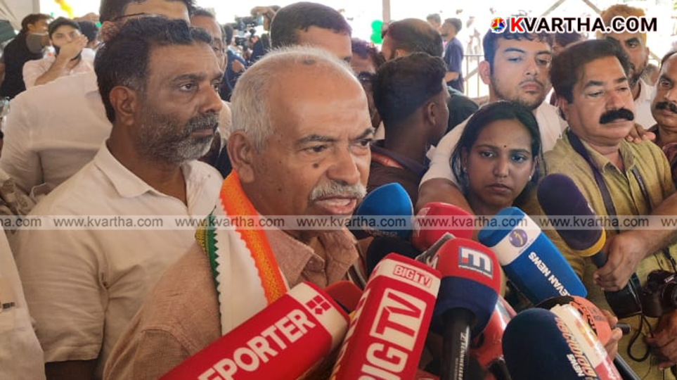  V. Kunjikrishnan displaying bank documents related to the Payyannur Martyr Fund scam in March 2026.