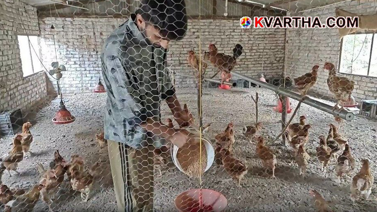 A successful young poultry farmer working in his farm.