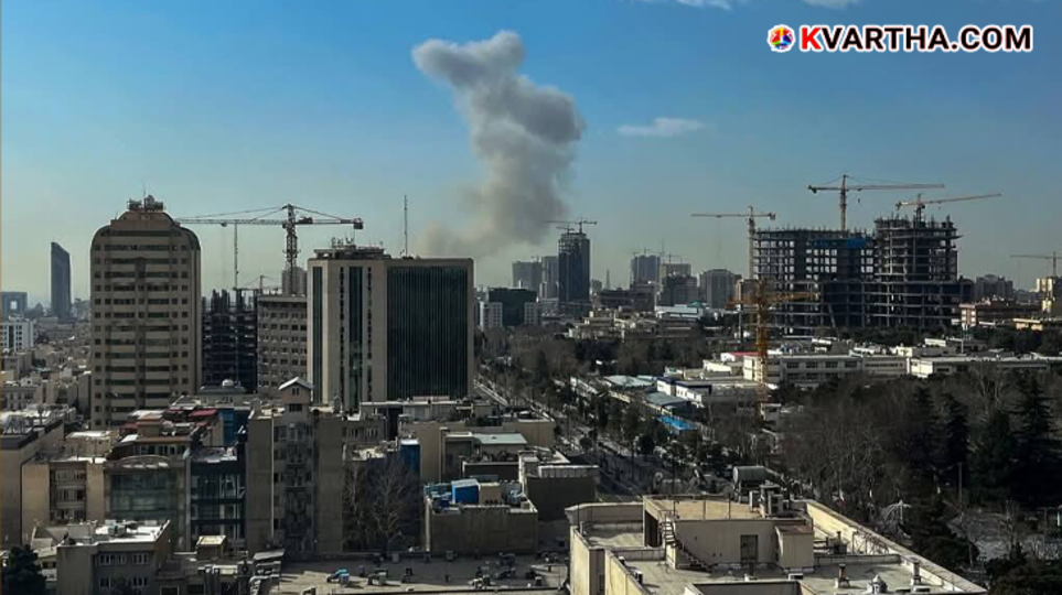 Explosions and fire lighting up the night sky over Tehran during an air raid.
