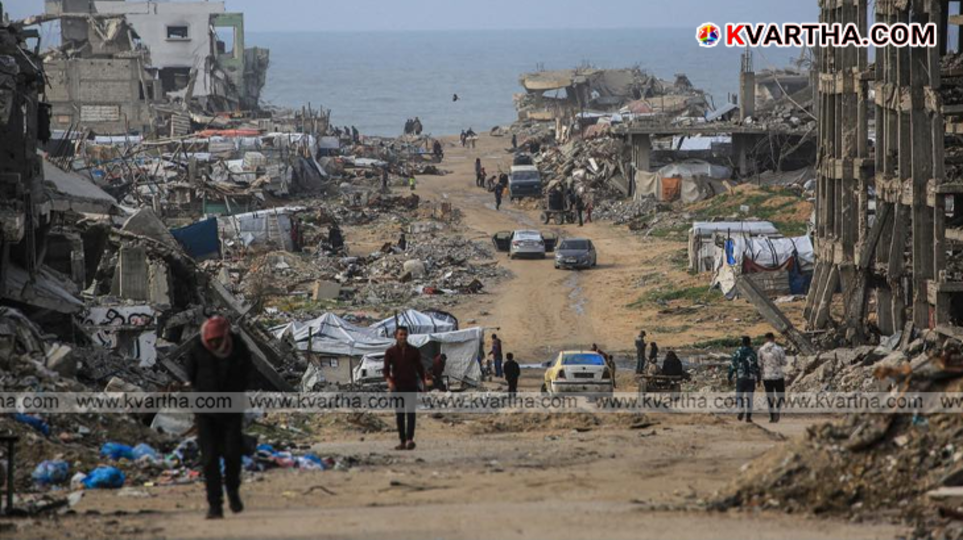 Destruction in Gaza city with smoke rising in the background amidst ceasefire talks.