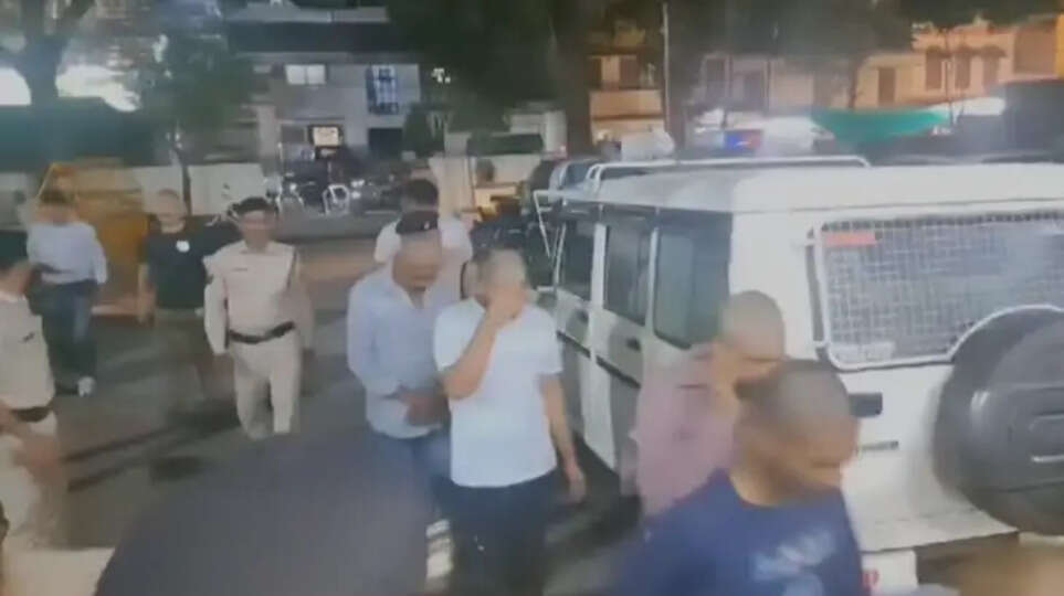   Youth being paraded after their heads are shaved by the police in Madhya Pradesh.