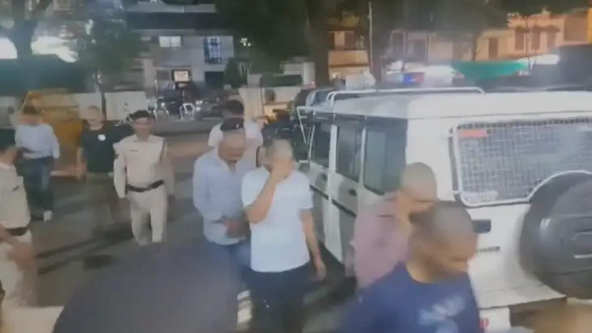   Youth being paraded after their heads are shaved by the police in Madhya Pradesh.