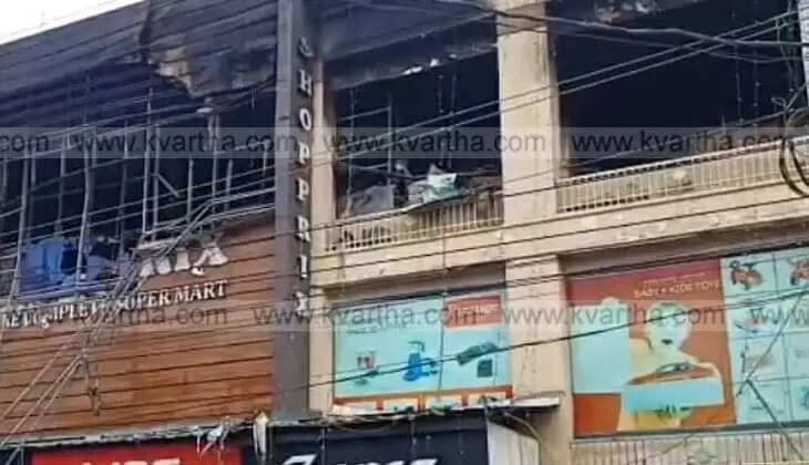 Burning supermarket building in Payyanur
