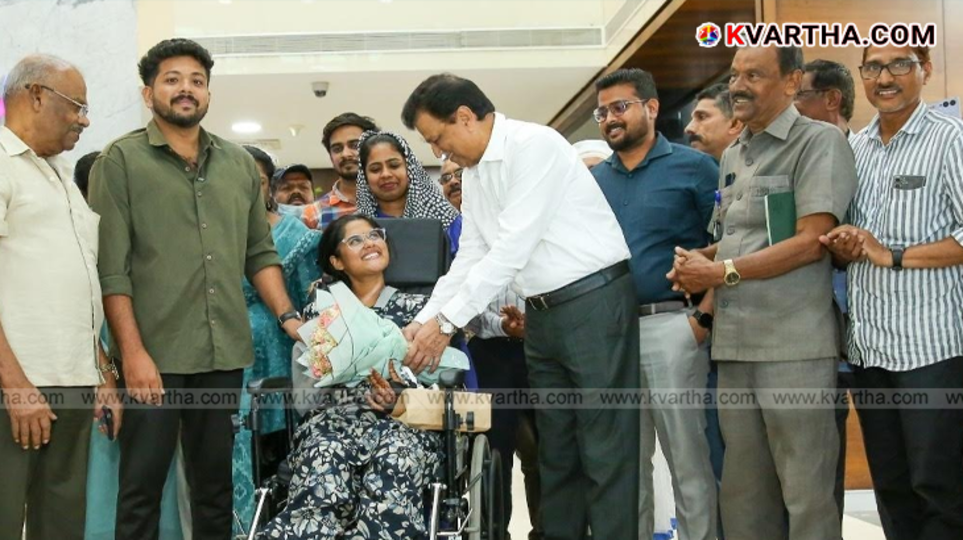 Avani and Sharon being discharged from hospital with bouquet.