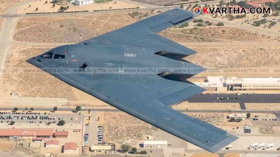 A B-2 Spirit stealth bomber in flight, showcasing its distinctive 'flying wing' design.