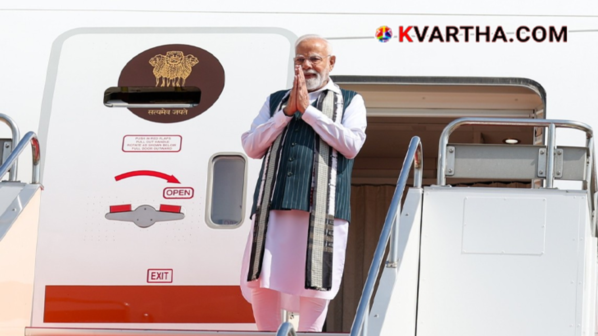 Prime Minister Narendra Modi waving before boarding his flight for a foreign tour.