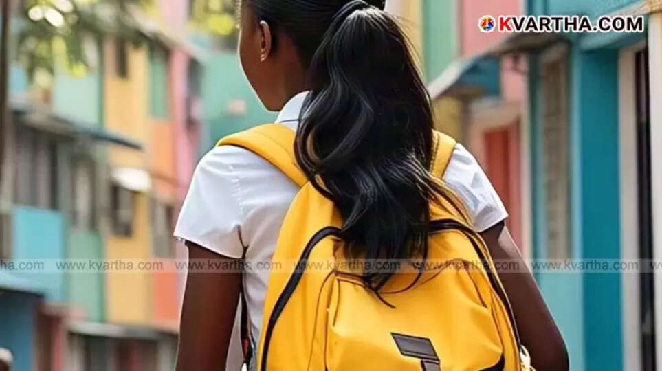 Chinmay Hegde with the girl who scored 97% after receiving educational support.