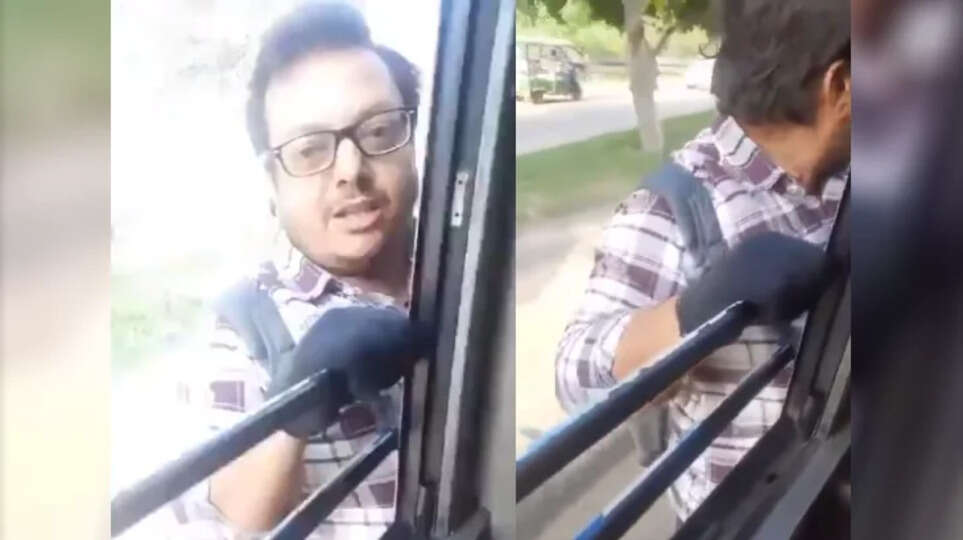 youth hangs from bus door for a kilometer