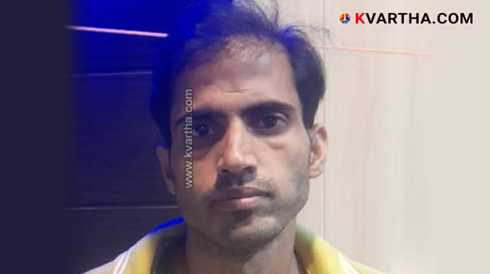 Police personnel arresting a suspect