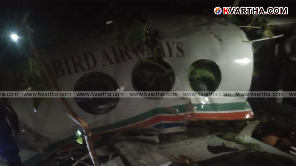 Wreckage of an air ambulance in a dense forest.