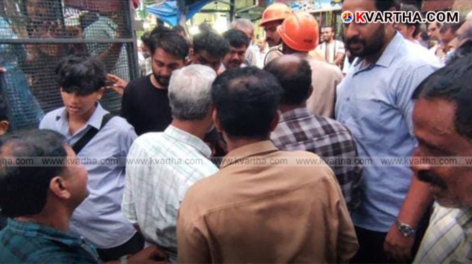 Fire force rescuing an elderly man whose foot is trapped in a drain grille in Kannur.