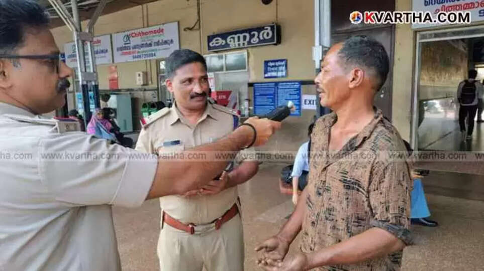 Police officer checking a male passenger using an alcometer.