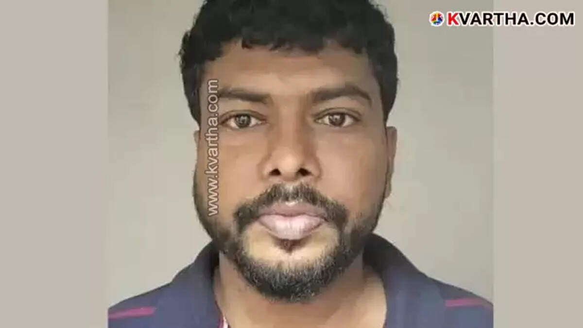 Kochi police arresting a man involved in job fraud scam