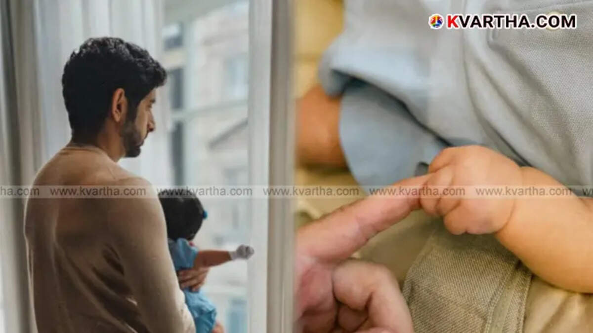 Dubai Crown Prince Sheikh Hamdan holding his newborn daughter in his arms.