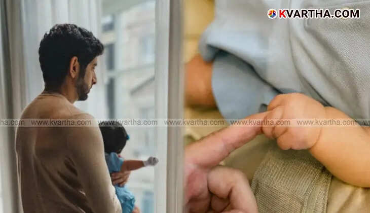 Dubai Crown Prince Sheikh Hamdan holding his newborn daughter in his arms.