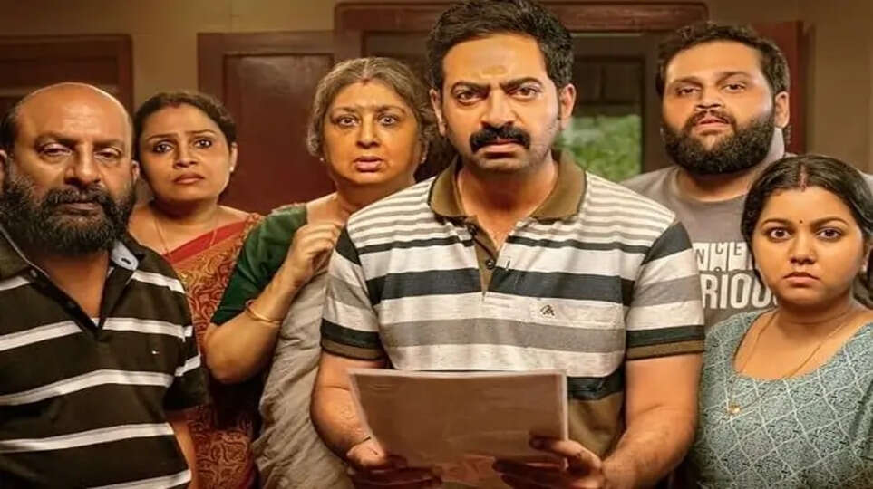 Saiju Kurup poses with the poster of his upcoming movie Bharatanatyam.