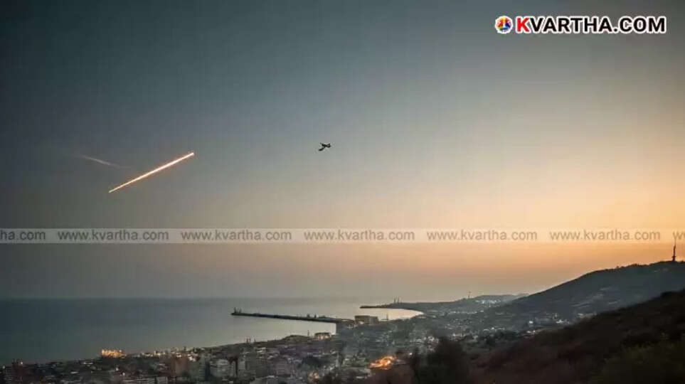 Aerial view of Haifa city with its port and oil refinery in the background.